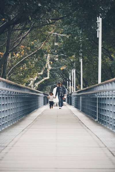 young couple in love walking on the bridge