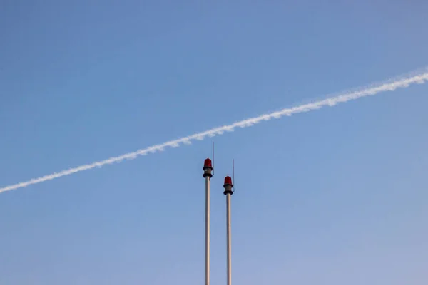 the red and white clouds on a background of blue sky