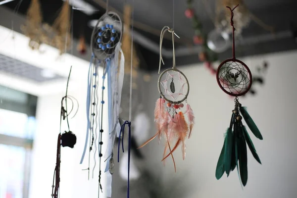 dream catcher hanging on a window