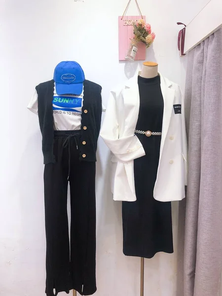 mannequin in a suit and a white shirt on a hanger