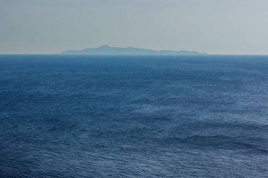 abstract picturesque background wallpaper scenic landscape of island in fog in ocean nature environment copy space for your text here