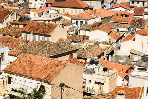 south Mediterranean small city houses with orange shingles roofs from above aerial shot