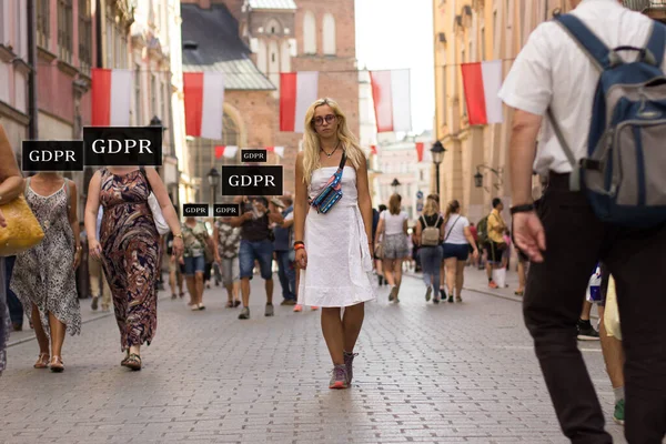 Data protection European Union law concept outdoor picture with unknown people with text instead cafes and beautiful woman portrait walking in white dress in Krakow Poland old street