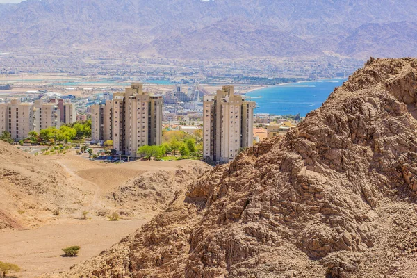 Eilat Israeli desert city Gulf of Aqaba Middle East region landmark urban buildings view from sand stone wilderness rocky mountains outskirts nature space