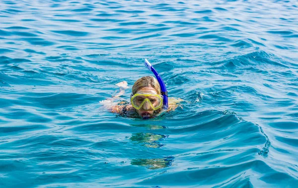 female portrait in mask snorkeling life style water activities in sea summer vacation time