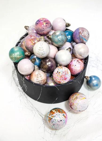 Christmas hand painted chocolate candy balls in a black gift box. — Stock Photo, Image