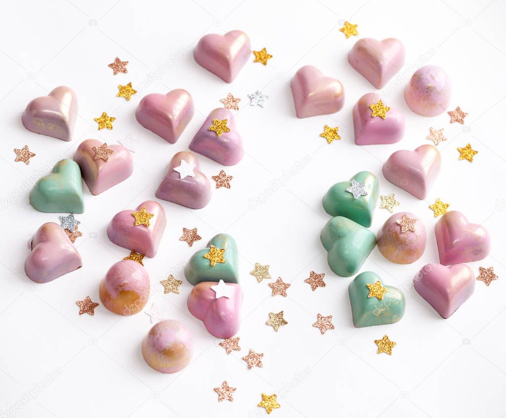Candy bonbon shape of hearts. White background.