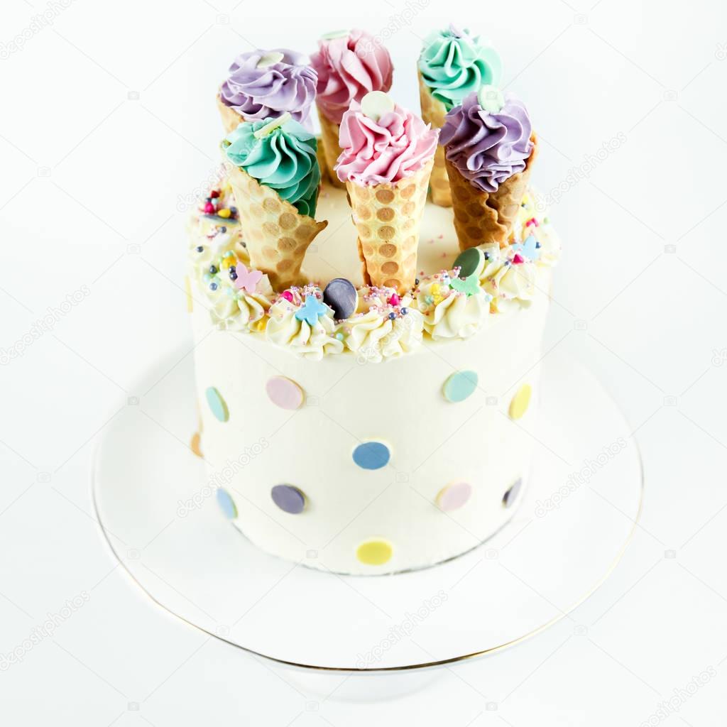 Birthday ice cream cone cake on a white background