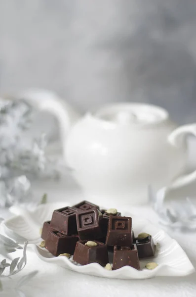 Homemade chocolates with a teapot and a cup of coffee — Stock Photo, Image