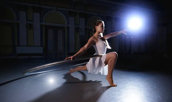 Professional circus performer posing on a scene