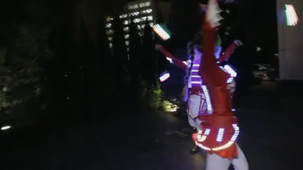 Show performance in LED costume at night outdoor — Stock Video