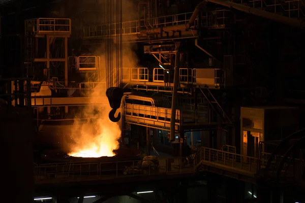Metallurgical plant, liquid metal in container. Big crane hook. — Stock Photo, Image
