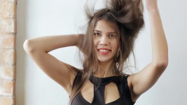 Attractive Woman Tousle Hair On White Background Slow Motion