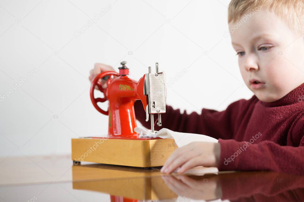 Boy and sewing machine