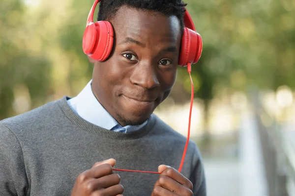African american man listen music in city