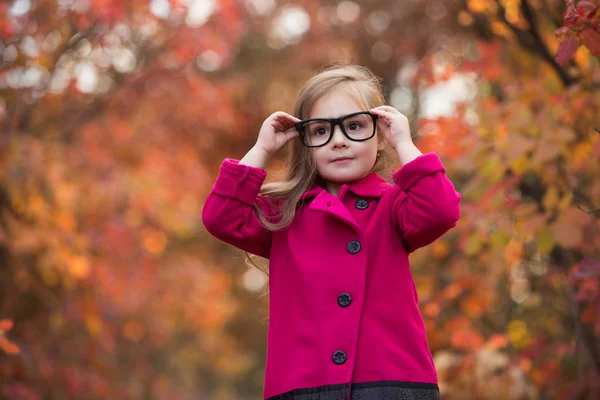 Little girl in autumn clothes — Stock Photo, Image