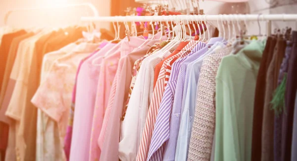 Clothes on hangers in store