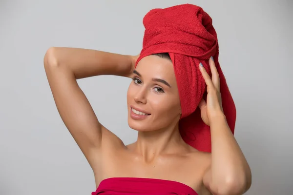 Beauty, woman after bath with towel on head isolated on grey background — Stock Photo, Image