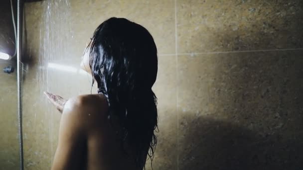 Woman taking a shower. Beautiful girl washing her body. — Stock Video