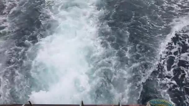 Boating on sea, water turbulence above back ship motor — Stock Video
