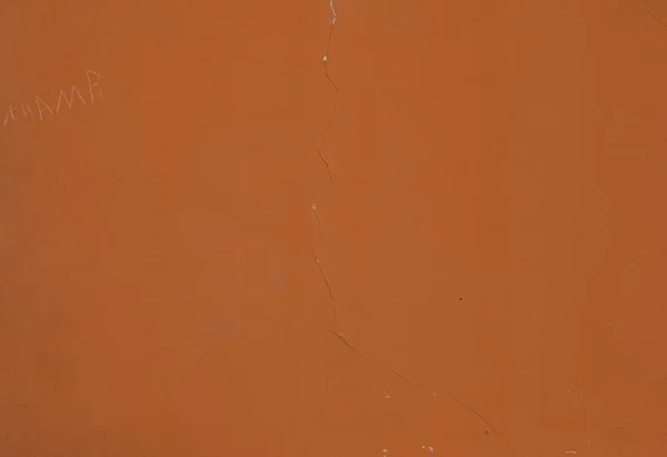 Textur der orande Wand mit Riss — Stockfoto
