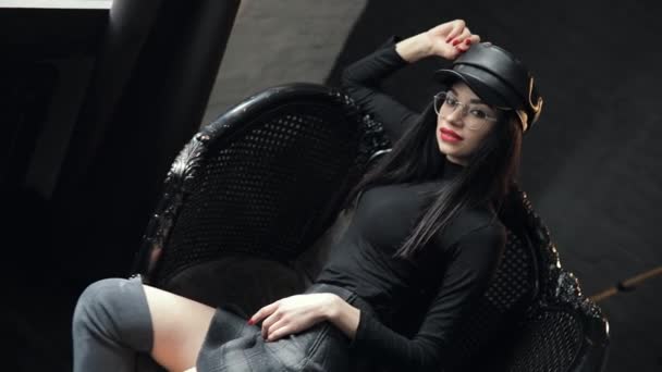 Sexy sensual woman in kepi posing on chair — Stock Video