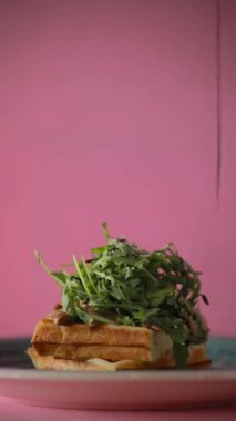 Add sauce on the food, vertical video