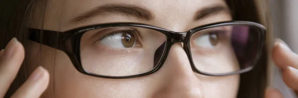 Myopia, woman looking through optical eyeglasses — Stok fotoğraf