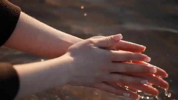 Silhouette of hand in sea water — Stock Video
