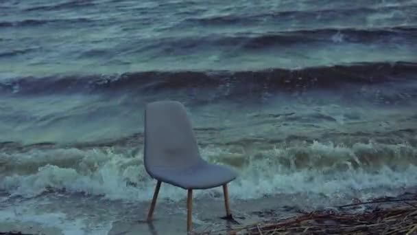 Chair in a stormy sea waves — Stock Video
