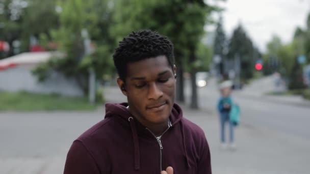 Stylish African American man dancing in summer city — Stock Video