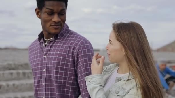 Happy multiracial friends talks walking in a city — Stock Video