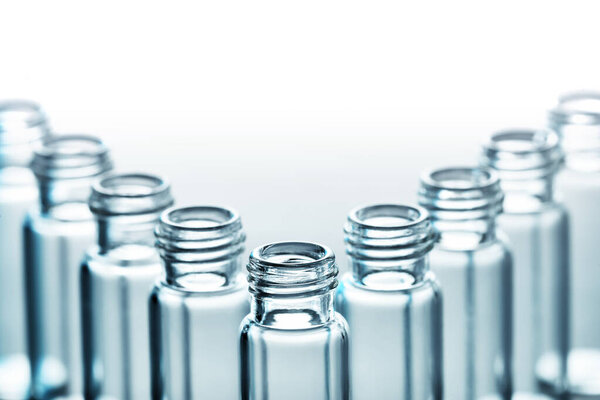 close-up of group of different bottles on white background
