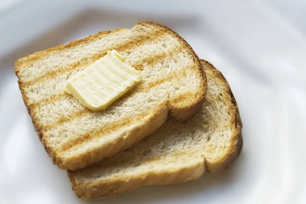 Tasty Toasts Butter White Background — стоковое фото