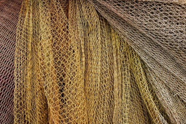 Background of fishing nets and the yellow color of burlap. Marine texture