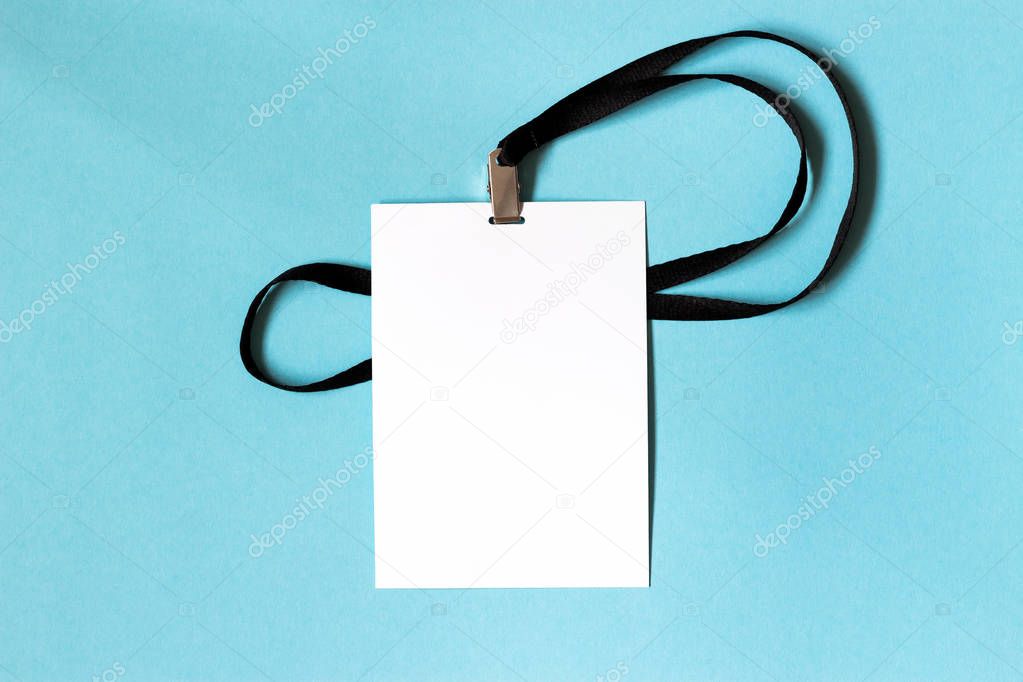 White blank paper badge mockup on blue background. Space for text. Template.