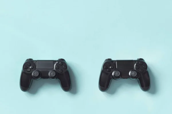 Gamepad from the game console on blue background. Concept of competition, game tournaments.