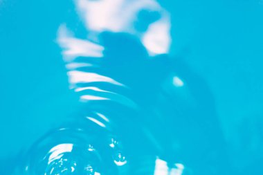 Su yüzeyi. Arka plan. Mavi sıvı doku.