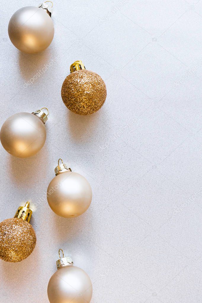 Modern glass Christmas golden minimalist balls on shiny silver b