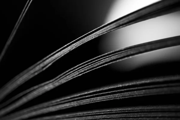 Black paper sheets with selective focus, close-up. Abstract blac