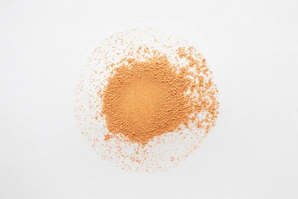 BB cream, CC cream or foundation circle smear on white background. Make-up product texture