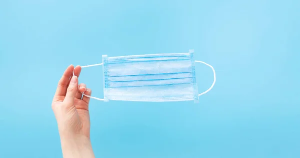 Human Hand Holding Disposable Sanitary Surgical Protective Face Mask Blue — Stock Photo, Image