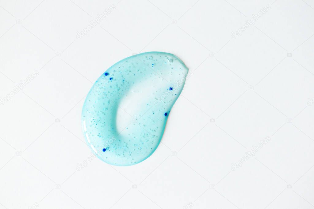Body scrub smudge on white background, above. Macro texture peeling cosmetic product. Beauty skin care treatment