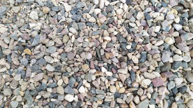 Arka plan güzel çakıl. Taş formunda bir yapı malzemesi. Bahçe yolları için serpintiler. Taşın dokusu..