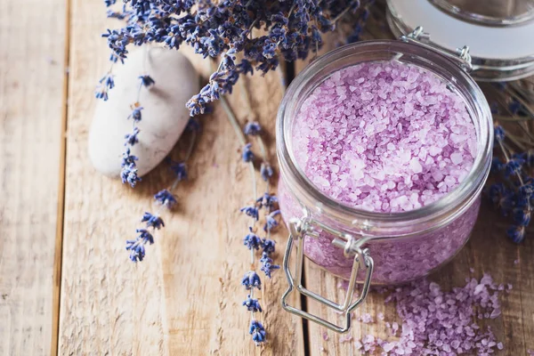 Lavander salt with natural spa products and decor for bath