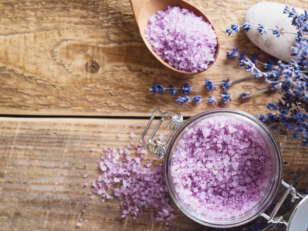 Lavander salt with natural spa products and decor for bath