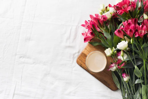 Flowers and coffee flat lay