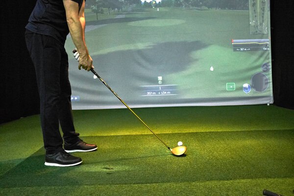 Playing golf on the simulator