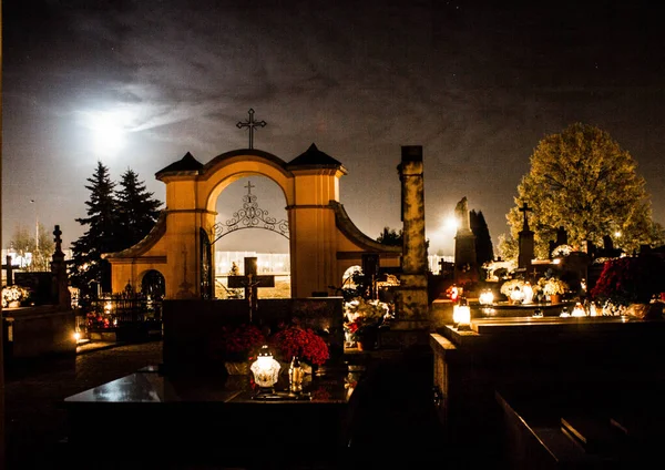 Night cemetery. Burning candles in the cemetery at night. Background.