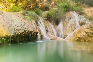 Polimnio waterfalls in Greece. A touristic destination. clipart